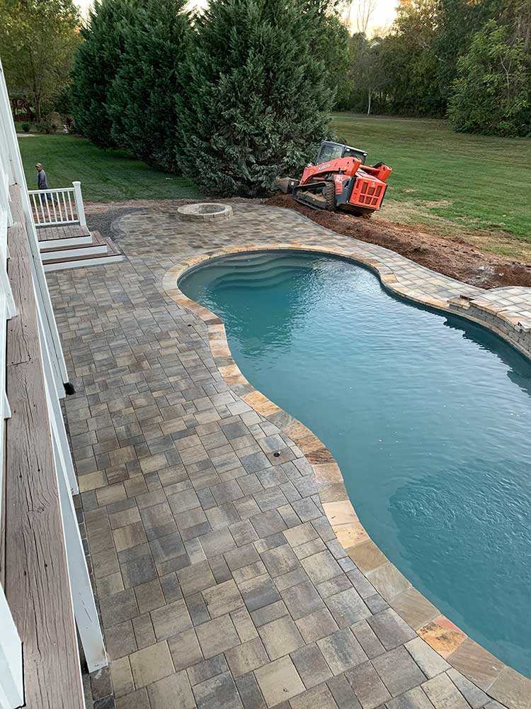 pool with paver decking